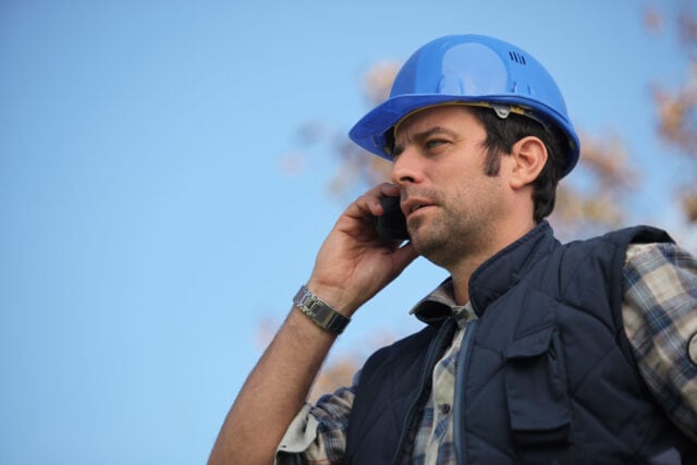 Construction Foreman Talking on the Phone