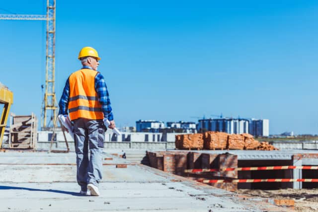 Construction manager Walking Through Empty Jobsite