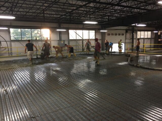 Crew Pumping Concrete on Mezzanine Floor